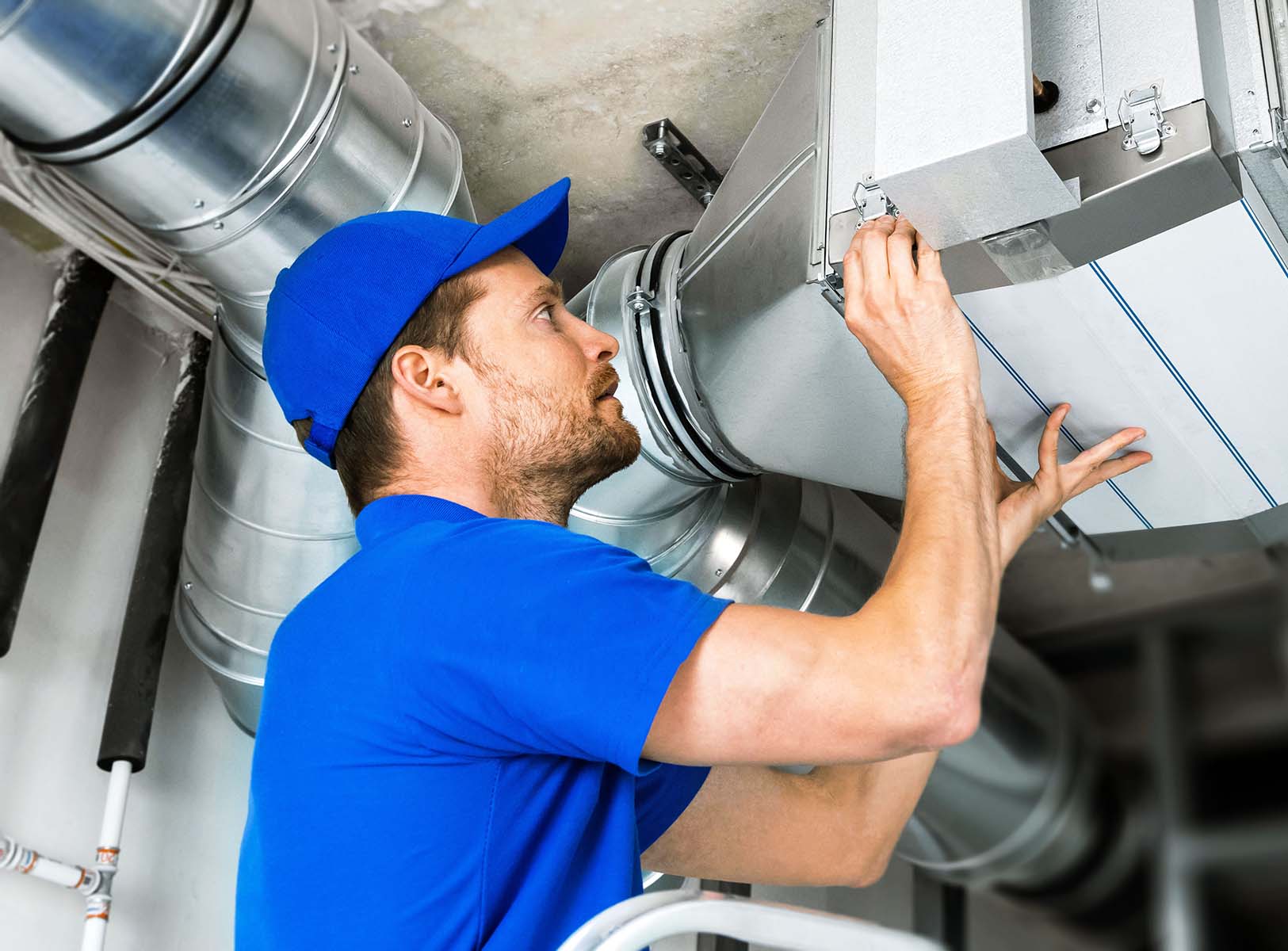 Technician%20working%20on%20industrial%20air%20ducts.