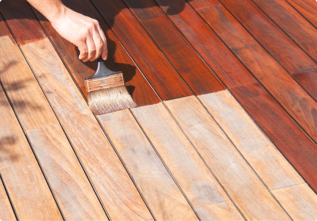 Deck-staining with a wide brush