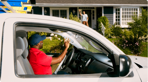Expert waving at homeowner from vehicle