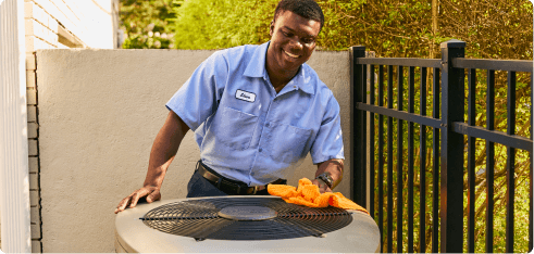 Repair expert cleaning HVAC unit