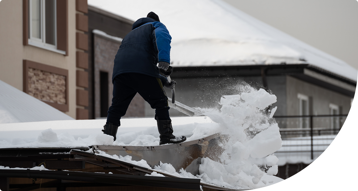 Shoveling snow from roof